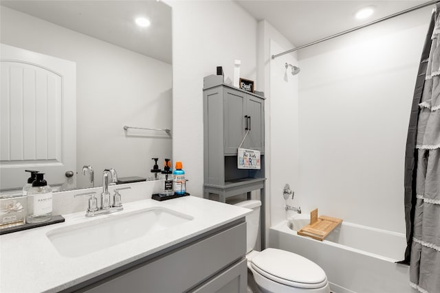 288 Caddo Bnd, Kyle, TX 78640 - bathroom featuring vanity, shower / bathtub combination with curtain, and recessed lighting