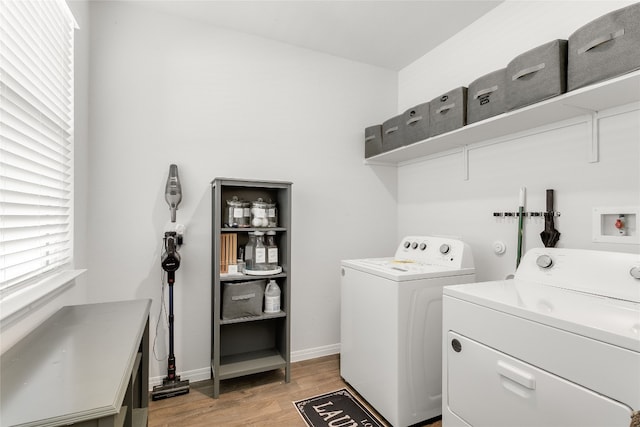 288 Caddo Bnd, Kyle, TX 78640 - laundry area featuring washer and dryer and light wood finished floors