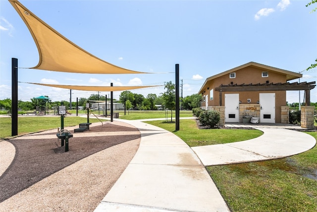 288 Caddo Bnd, Kyle, TX 78640 - view of home's community with a lawn