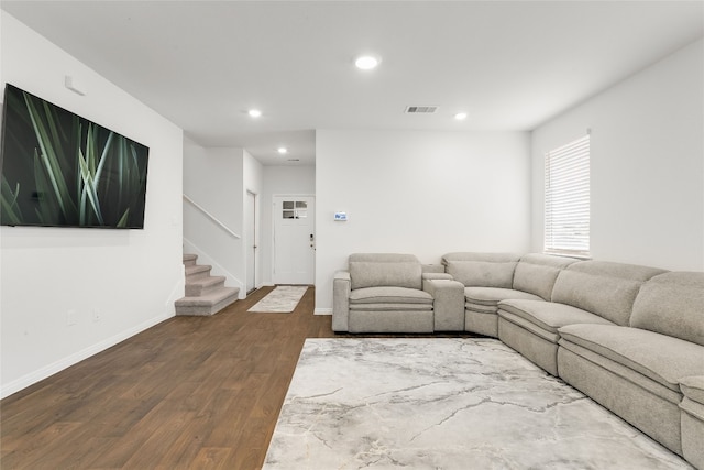 288 Caddo Bnd, Kyle, TX 78640 - living room with recessed lighting, dark wood-style floors, and stairs