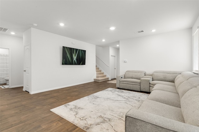 288 Caddo Bnd, Kyle, TX 78640 - living area featuring dark wood-style flooring, recessed lighting, and stairs