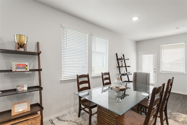 288 Caddo Bnd, Kyle, TX 78640 - dining area with baseboards and wood finished floors