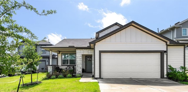 288 Caddo Bnd, Kyle, TX 78640 - view of front facade featuring a front lawn, an attached garage, concrete driveway, a porch, and board and batten siding