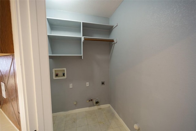 1118 Connemara Ln, Pflugerville, TX 78660 - laundry area with hookup for a gas dryer, hookup for a washing machine, hookup for an electric dryer, and light tile patterned flooring