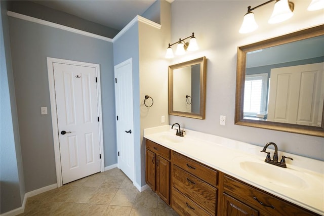 1118 Connemara Ln, Pflugerville, TX 78660 - bathroom with double vanity, tile patterned flooring, and crown molding