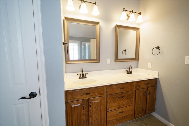 1118 Connemara Ln, Pflugerville, TX 78660 - bathroom featuring double vanity and tile patterned floors