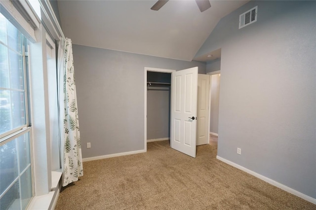 1118 Connemara Ln, Pflugerville, TX 78660 - unfurnished bedroom with carpet flooring, vaulted ceiling, a closet, baseboards, and a ceiling fan