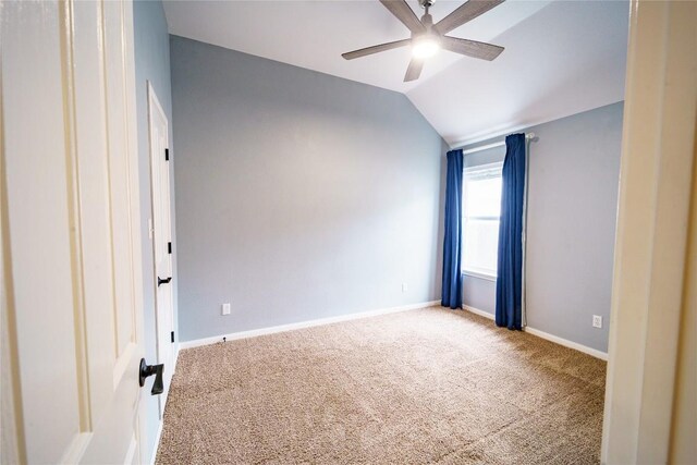 1118 Connemara Ln, Pflugerville, TX 78660 - empty room featuring ceiling fan, carpet, vaulted ceiling, and baseboards