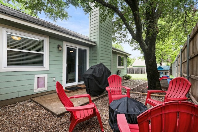 12320 Cedarspur Rd, Austin, TX 78758 - fenced backyard featuring grilling area and an outdoor fire pit