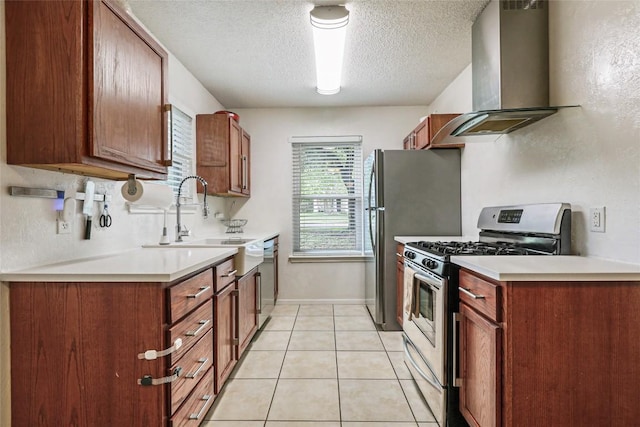 12320 Cedarspur Rd, Austin, TX 78758 - kitchen featuring stainless steel appliances, island exhaust hood, a textured ceiling, a sink, and light countertops
