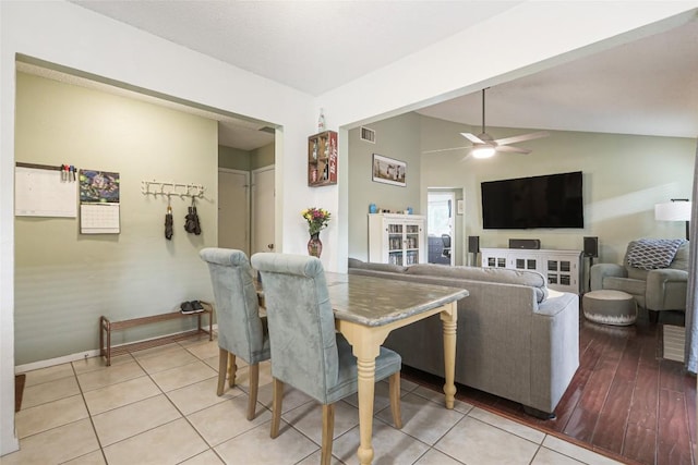 12320 Cedarspur Rd, Austin, TX 78758 - dining area with baseboards, ceiling fan, vaulted ceiling, and light tile patterned floors
