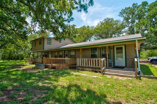 1162 N State Highway 95, Bastrop, TX 78602 - view of front of property featuring covered porch and a front lawn
