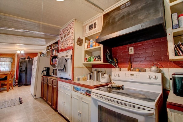 1162 N State Highway 95, Bastrop, TX 78602 - kitchen featuring white appliances, open shelves, custom range hood, and light countertops