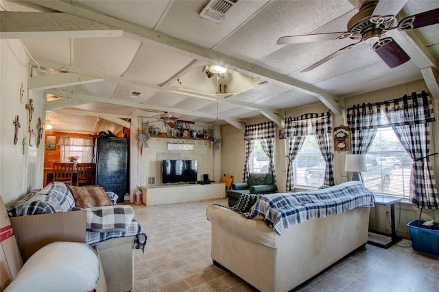 1162 N State Highway 95, Bastrop, TX 78602 - living room featuring a ceiling fan, plenty of natural light, and coffered ceiling