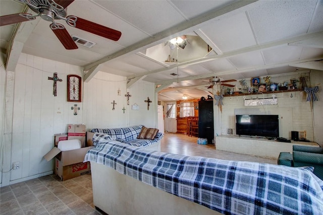 1162 N State Highway 95, Bastrop, TX 78602 - living area with a ceiling fan and wood walls