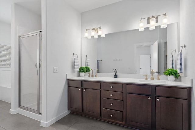 8940 Parker Ranch Cir Unit B, Austin, TX 78748 - full bath with tile patterned floors, double vanity, a shower stall, and a tub