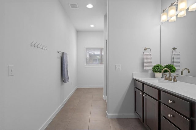 8940 Parker Ranch Cir Unit B, Austin, TX 78748 - bathroom with vanity, tile patterned flooring, baseboards, and recessed lighting