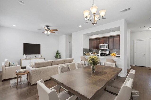 8940 Parker Ranch Cir Unit B, Austin, TX 78748 - dining area with a chandelier, dark wood-style flooring, recessed lighting, ceiling fan, and baseboards