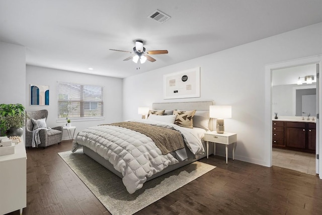 8940 Parker Ranch Cir Unit B, Austin, TX 78748 - bedroom with wood finished floors, ensuite bath, baseboards, ceiling fan, and a sink
