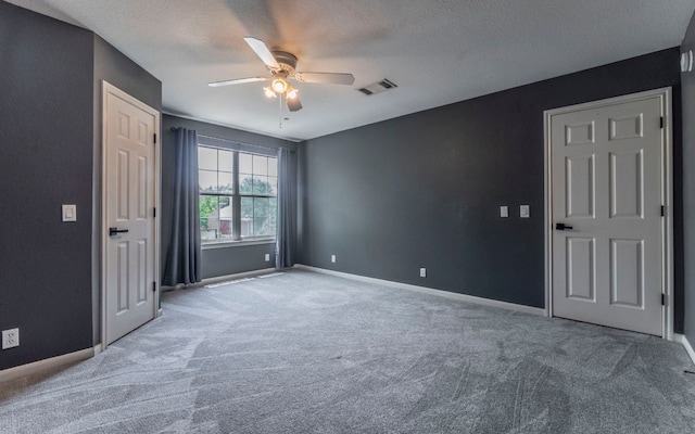 208 Settlers Valley Dr, Pflugerville, TX 78660 - unfurnished bedroom with carpet flooring, baseboards, and a textured ceiling