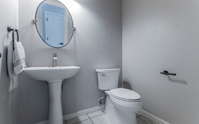 208 Settlers Valley Dr, Pflugerville, TX 78660 - half bathroom with toilet, tile patterned flooring, and baseboards