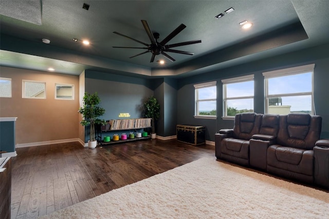 403 Baldovino Skwy, Austin, TX 78738 - living room featuring a raised ceiling, wood-type flooring, a ceiling fan, and recessed lighting
