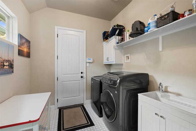 403 Baldovino Skwy, Austin, TX 78738 - laundry area featuring cabinet space and washer and dryer
