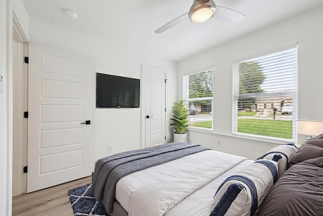 6102 Amber Pass, Austin, TX 78745 - bedroom featuring light wood-style floors and a ceiling fan