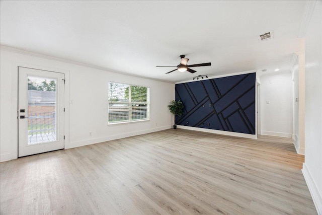 6102 Amber Pass, Austin, TX 78745 - unfurnished living room with ceiling fan, light wood-style flooring, baseboards, and crown molding