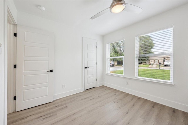 6102 Amber Pass, Austin, TX 78745 - unfurnished bedroom featuring light wood-style floors, baseboards, and ceiling fan