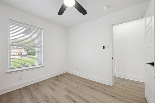 6102 Amber Pass, Austin, TX 78745 - unfurnished room featuring light wood-type flooring, ceiling fan, and baseboards