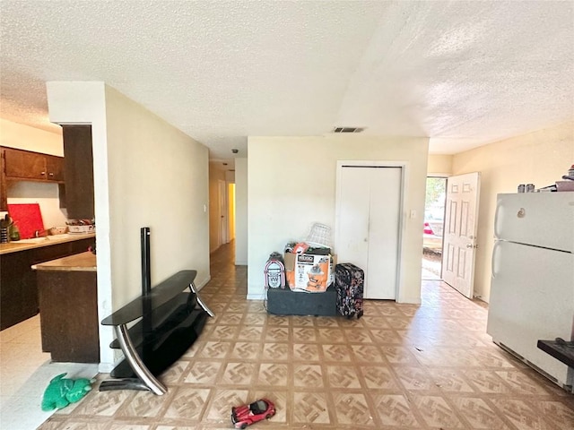 5005 S Pleasant Valley Rd, Austin, TX 78744 - living room with a textured ceiling and light floors