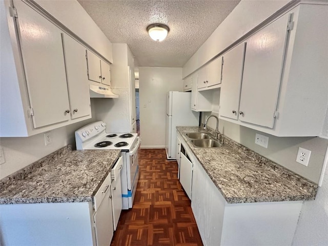 5005 S Pleasant Valley Rd, Austin, TX 78744 - kitchen with white appliances, a textured ceiling, a sink, under cabinet range hood, and white cabinetry