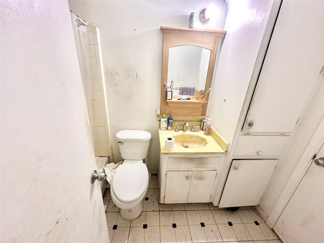 5005 S Pleasant Valley Rd, Austin, TX 78744 - bathroom with toilet, vanity, tile patterned flooring, and curtained shower