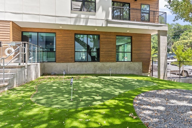 2500 Longview St Unit 101, Austin, TX 78705 - view of exterior entry featuring a balcony