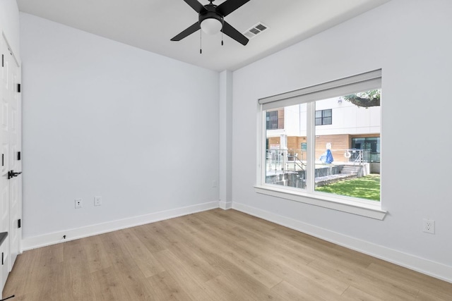 2500 Longview St Unit 101, Austin, TX 78705 - spare room featuring light wood-style flooring, a ceiling fan, and baseboards