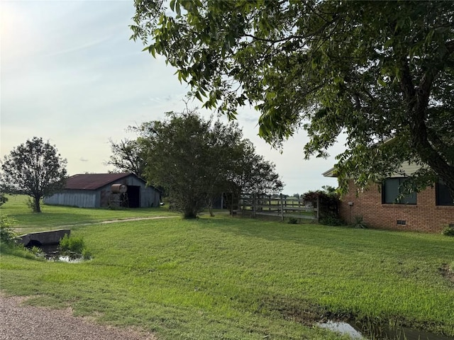 429 Camelback Rd, La Grange, TX 78945 - view of grassy yard with an outbuilding and an outdoor structure