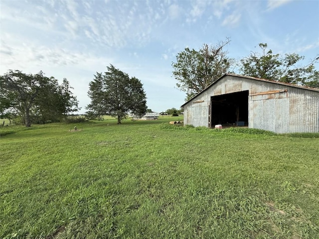 429 Camelback Rd, La Grange, TX 78945 - view of green lawn with a pole building, an outdoor structure, and a detached garage