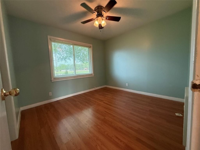 429 Camelback Rd, La Grange, TX 78945 - empty room with wood finished floors, a ceiling fan, and baseboards
