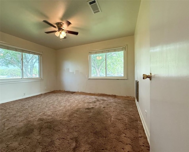 429 Camelback Rd, La Grange, TX 78945 - carpeted spare room featuring ceiling fan, healthy amount of natural light, and baseboards