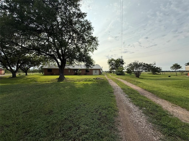 429 Camelback Rd, La Grange, TX 78945 - view of front of home with dirt driveway and a front yard