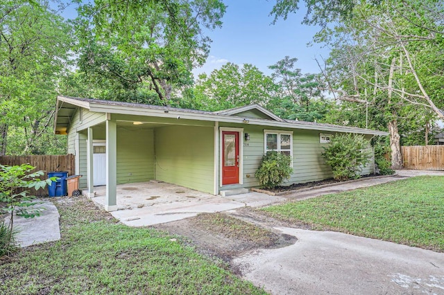 704 Wren Ave, Austin, TX 78753 - view of front of home featuring asphalt driveway and an attached carport