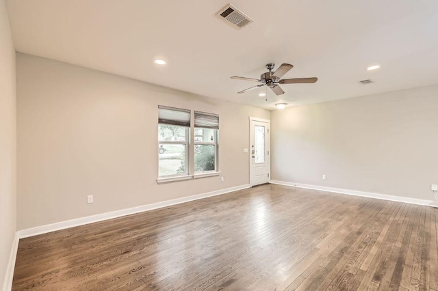704 Wren Ave, Austin, TX 78753 - unfurnished room featuring wood finished floors, ceiling fan, and recessed lighting