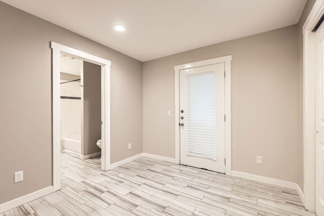 704 Wren Ave, Austin, TX 78753 - foyer with light wood-style flooring and recessed lighting