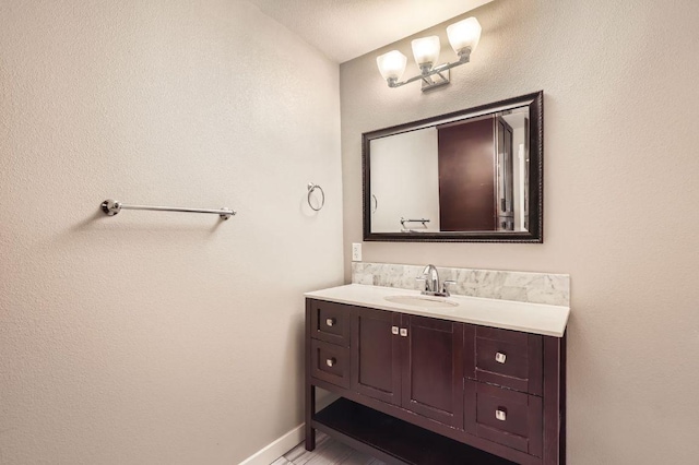 704 Wren Ave, Austin, TX 78753 - bathroom featuring vanity and baseboards