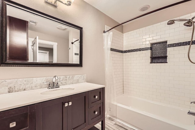 704 Wren Ave, Austin, TX 78753 - bathroom featuring vanity and shower / tub combo with curtain