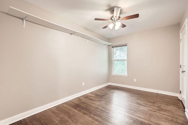 704 Wren Ave, Austin, TX 78753 - unfurnished room with a ceiling fan, dark wood-type flooring, and baseboards