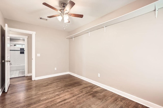 704 Wren Ave, Austin, TX 78753 - unfurnished room featuring ceiling fan and dark wood-style floors