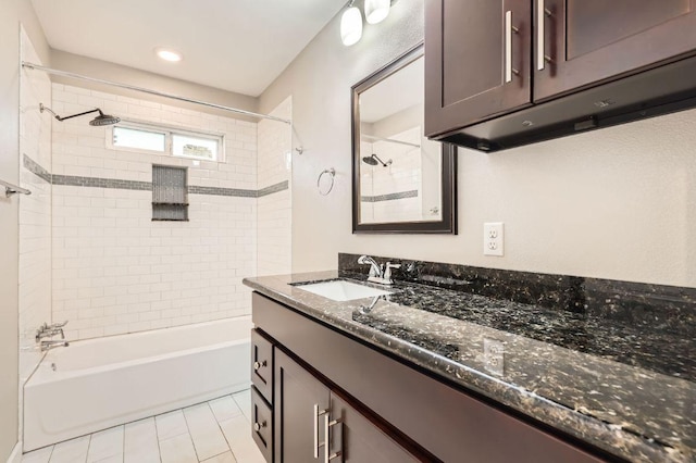704 Wren Ave, Austin, TX 78753 - bathroom with vanity, washtub / shower combination, and tile patterned floors