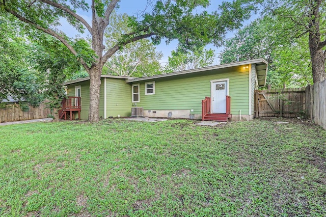 704 Wren Ave, Austin, TX 78753 - back of house featuring entry steps and a fenced backyard